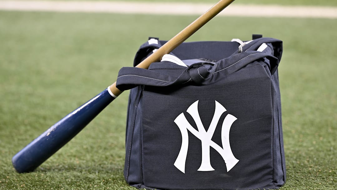 Aug 4, 2025; Arlington, Texas, USA; A view of a baseball bat and a New York Yankees bag and logo before the game between the Texas Rangers and the Yankees at Globe Life Field. Mandatory Credit: Jerome Miron-Imagn Images Aug 4, 2025; Arlington, Texas, USA; A view of a baseball bat and a New York Yankees bag and logo before the game between the Texas Rangers and the Yankees at Globe Life Field. Mandatory Credit: Jerome Miron-Imagn Images