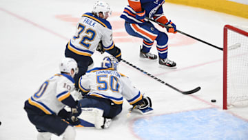 Apr 9, 2025; Edmonton, Alberta, CAN; St. Louis Blues goalie Jordan Binnington (50), defenseman Justin Faulk  (72) and center Brayden Schenn( 10) watch as Edmonton Oilers center Connor McDavid (97) skates past during the third period at Rogers Place. Mandatory Credit: Walter Tychnowicz-Imagn Images
