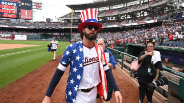 Jul 4, 2024; Washington, District of Columbia, USA; Washington Nationals left fielder Jesse Winker (6) walks back to the dugout while wearing a patriotic themed top hat after the game against the New York Mets at Nationals Park. Mandatory Credit: Rafael Suanes-USA TODAY Sports