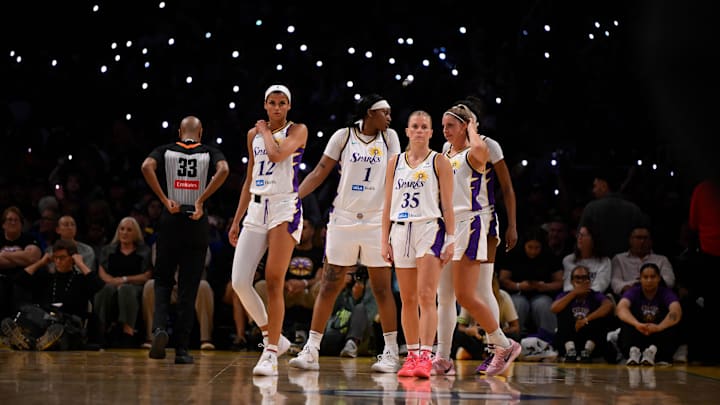Los Angeles Sparks players Rae Burrell (12), Julie Vanloo (35), Sania Feagin (1), and Sarah Ashlee Barker (13) at Crypto.com Arena. Los Angeles Sparks players Rae Burrell (12), Julie Vanloo (35), Sania Feagin (1), and Sarah Ashlee Barker (13) at Crypto.com Arena.