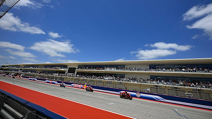 Apr 14, 2024; Austin, TX, USA; A view of the fans in paddock as the riders drive down the front stretch during the MotoGP Grand Prix of The Americas at Circuit of The Americas. Mandatory Credit: Jerome Miron-Imagn Images