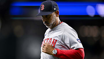 Boston Red Sox manager Alex Cora (13) runs back to the dugout during the sixth inning against the Texas Rangers at Globe Life Field.