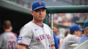 Aug 20, 2025; Washington, District of Columbia, USA;  New York Mets manager Carlos Mendoza (64) stands in the dugout before a game against the Washington Nationals at Nationals Park. Mandatory Credit: Rafael Suanes-Imagn Images
