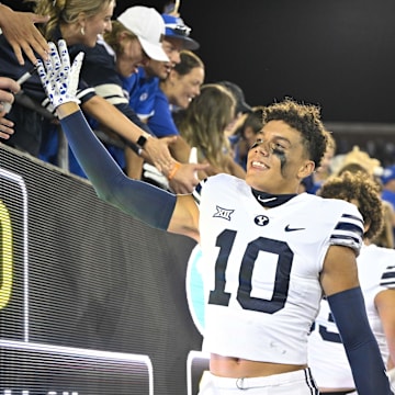 Sep 6, 2024; Dallas, Texas, USA; Brigham Young Cougars safety Faletau Satuala (10) slaps hands with the fans after the Cougars win over the Southern Methodist Mustangs at Gerald J. Ford Stadium.