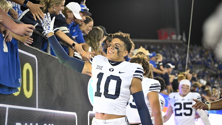 Sep 6, 2024; Dallas, Texas, USA; Brigham Young Cougars safety Faletau Satuala (10) slaps hands with the fans after the Cougars win over the Southern Methodist Mustangs at Gerald J. Ford Stadium.