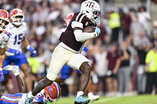 Oct 11, 2025; College Station, Texas, USA; Texas A&M Aggies running back Le'Veon Moss (8) runs the ball for a touchdown