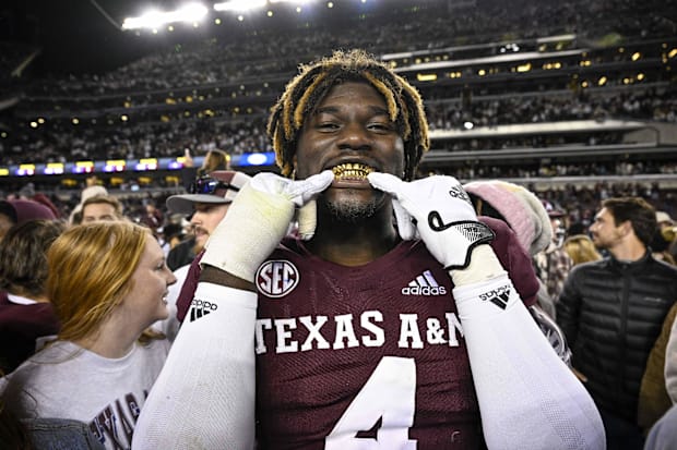 Aggies defensive lineman Shemar Stewart (4) shows off his gold grill