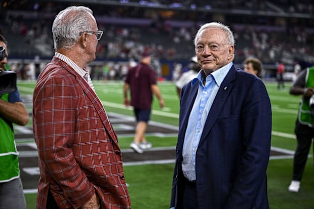 Dallas Cowboys owner Jerry Jones and Stephen Jones wait to present the winner's trophy at AT&T Stadium