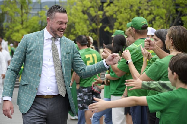 Oregon Ducks head coach Dan Lanning greets fans before a game against the Oklahoma State Cowboys at Autzen Stadium. Mandatory