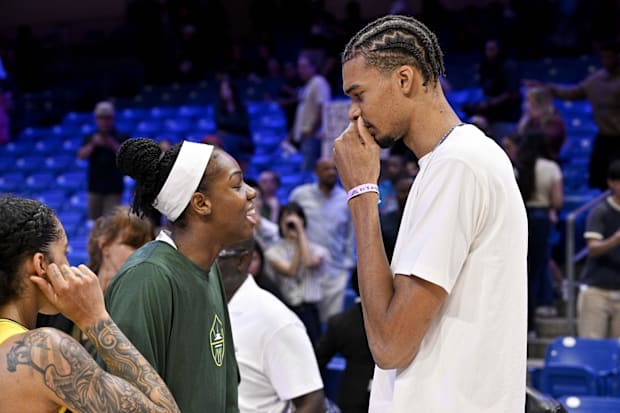 Seattle Storm center Dominique Malonga (left) talks with San Antonio Spurs forward Victor Wembanyama (right) after the game a