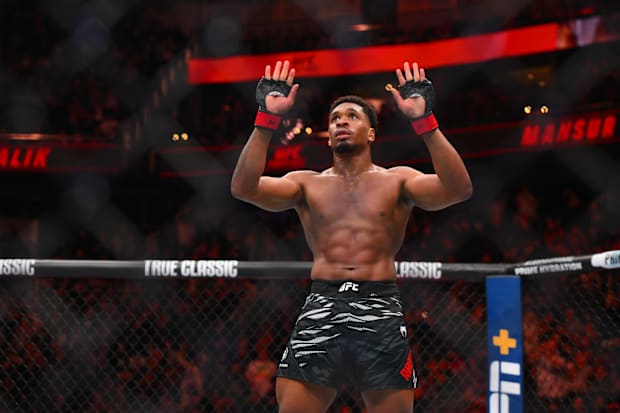 Mansur Abdul-Malik (red gloves) celebrates defeating Nick Klein (blue gloves) in the middleweight bout during UFC Fight Night