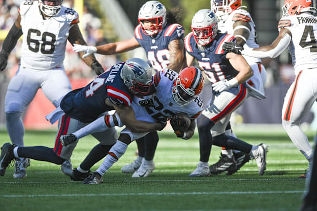 Oct 26, 2025; Foxborough, Massachusetts, USA; New England Patriots linebacker Robert Spillane (14) tackles Cleveland Browns
