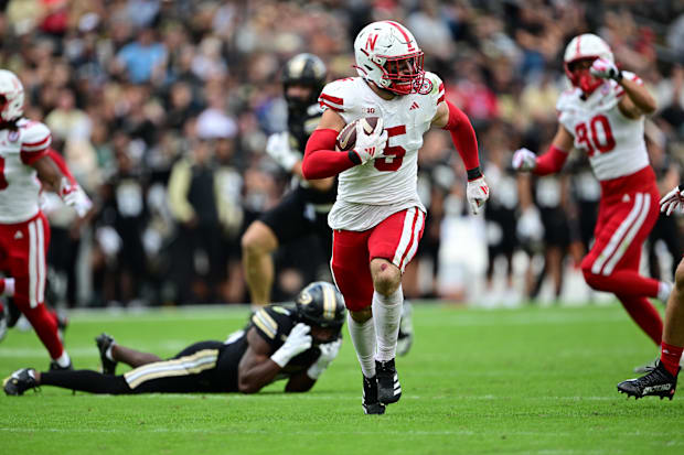 Nebraska linebacker John Bullock runs with the ball for a pick-six against the Purdue Boilermakers.