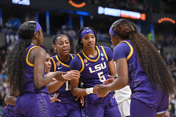 LSU Lady Tigers huddle during the second half of a Sweet 16 NCAA Tournament basketball game against the NC State Wolfpack.
