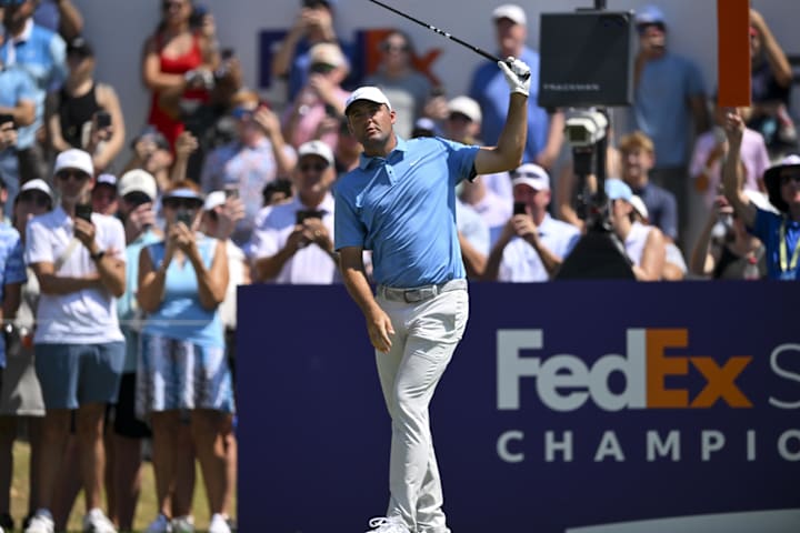 Scottie Scheffler plays his shot from the first tee during the third round of the FedEx St. Jude Championship 