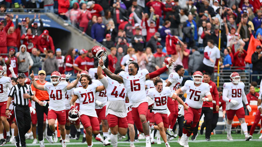 The Cougars celebrate defeating the Huskies in the Apple Cup rivalry game.