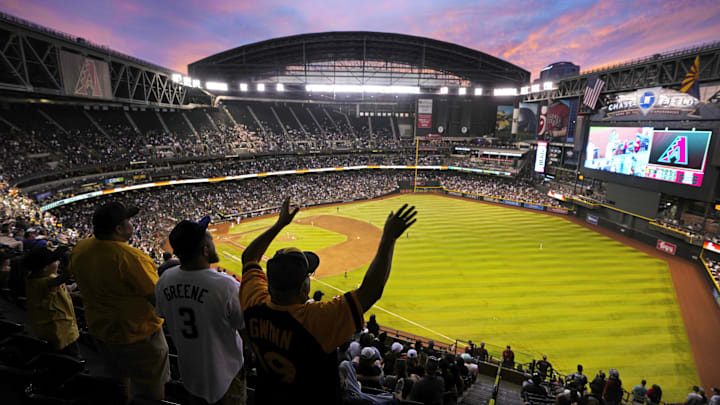 Padres fans watch the sun set in the seventh inning during a game against the Diamondbacks at Chase Field in Phoenix on April 22, 2023. Padres fans watch the sun set in the seventh inning during a game against the Diamondbacks at Chase Field in Phoenix on April 22, 2023.