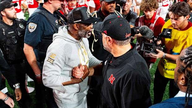 Colorado Buffaloes head coach Deion Sanders and Nebraska Cornhuskers head coach Matt Rhule shake hands after the Cornhuskers 