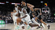 Jan 27, 2024; San Antonio, Texas, USA; Minnesota Timberwolves guard Anthony Edwards (5) drives to the basket past San Antonio Spurs forward Victor Wembanyama (1) during the second half at Frost Bank Center. Mandatory Credit: Scott Wachter-Imagn Images