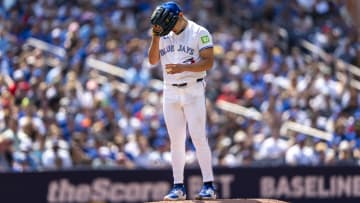 Jul 20, 2024; Toronto, Ontario, CAN; Toronto Blue Jays pitcher Yusei Kikuchi (16) covers his head with his glove during the first inning against the Detroit Tigers at Rogers Centre. Mandatory Credit: Kevin Sousa-USA TODAY Sports