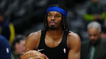 Feb 20, 2025; Denver, Colorado, USA; Denver Nuggets center DaRon Holmes II (14) warms up before the game against the Charlotte Hornets at Ball Arena. Mandatory Credit: Ron Chenoy-Imagn Images