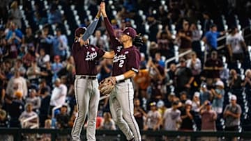 Jun 19, 2024; Omaha, NE, USA; Texas A&M Aggies second  baseman Jack Bell (1) and shortstop Ali Camarillo (2) celebrate after defeating the Florida Gators to make it to the championship at Charles Schwab Field Omaha. Mandatory Credit: Dylan Widger-USA TODAY Sports