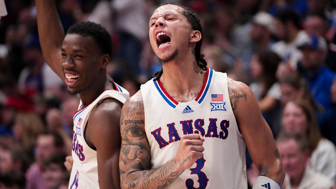 Dec 22, 2025; Lawrence, Kansas, USA; Kansas Jayhawks guard Melvin Council Jr. (14) and guard Tre White (3) celebrate on the bench against the Davidson Wildcats during the second half of the game at Allen Fieldhouse. Mandatory Credit: Denny Medley-Imagn Images Dec 22, 2025; Lawrence, Kansas, USA; Kansas Jayhawks guard Melvin Council Jr. (14) and guard Tre White (3) celebrate on the bench against the Davidson Wildcats during the second half of the game at Allen Fieldhouse. Mandatory Credit: Denny Medley-Imagn Images