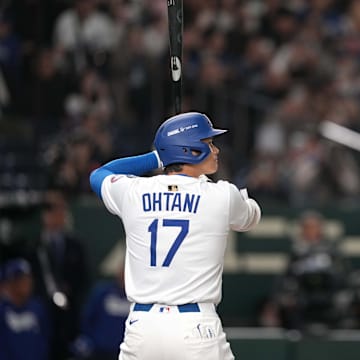 Mar 15, 2025; Bunkyo, Tokyo, Japan; Los Angeles Dodgers designated hitter Shohei Ohtani (17) bats against the Yomiuri Giants during the first inning at Tokyo Dome. Mandatory Credit: Darren Yamashita-Imagn Images