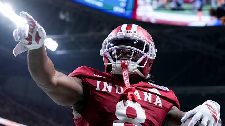 Indiana Hoosiers running back Kaelon Black (8) celebrates after rushing in a touchdown Friday, Jan. 9, 2026, during the Peach Bowl and semifinal game of the College Football Playoff against the Oregon Ducks at Mercedes-Benz Stadium in Atlanta.