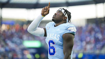 Aug 29, 2024; Kansas City, Kansas, USA; Kansas Jayhawks quarterback Jalon Daniels (6) gets ready before a game against the Lindenwood Lions at Children's Mercy Park. Mandatory Credit: Jay Biggerstaff-Imagn Images