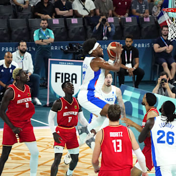 Aug 8, 2024; Paris, France; France power forward Guerschon Yabusele (7) goes to the basket during the first half against France in a men's basketball semifinal game during the Paris 2024 Olympic Summer Games at Accor Arena. Mandatory Credit: Rob Schumacher-Imagn Images