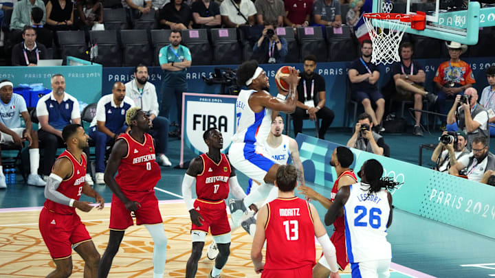 Aug 8, 2024; Paris, France; France power forward Guerschon Yabusele (7) goes to the basket during the first half against France in a men's basketball semifinal game during the Paris 2024 Olympic Summer Games at Accor Arena. Mandatory Credit: Rob Schumacher-Imagn Images