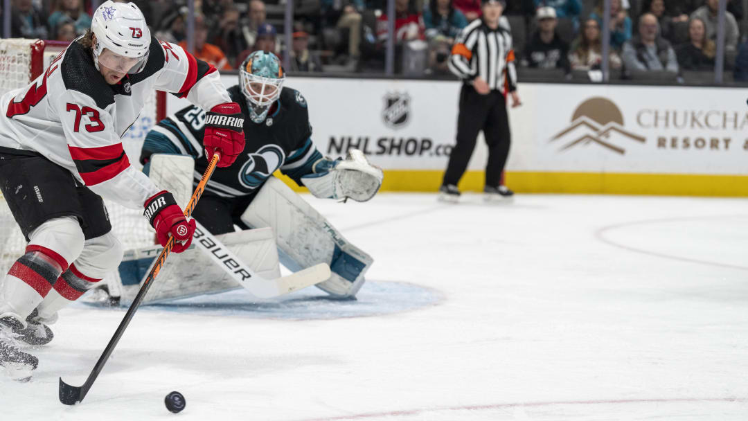 Feb 27, 2024; San Jose, California, USA;  New Jersey Devils right wing Tyler Toffoli (73) receives the pass in front of the net while San Jose Sharks goaltender Mackenzie Blackwood (29) looks on during the first period at SAP Center at San Jose. Mandatory Credit: Neville E. Guard-USA TODAY Sports