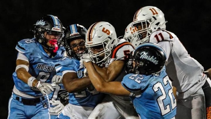 Hagerty's Leo Gutierrez (22), one of many talented returnees for 2025, helps to make a tackle during a 2024 game.