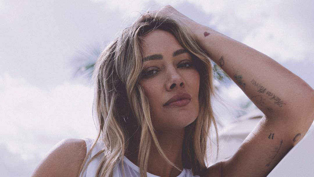 Hilary Duff was photographed by Kat Irlin in South Caicos. Swimsuit by OYE Swimwear.