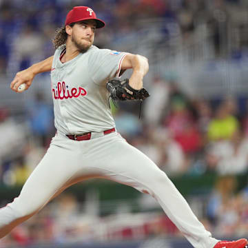 Sep 7, 2024; Miami, Florida, USA;  Philadelphia Phillies pitcher Aaron Nola (27) pitches in the first inning against the Miami Marlins at loanDepot Park.