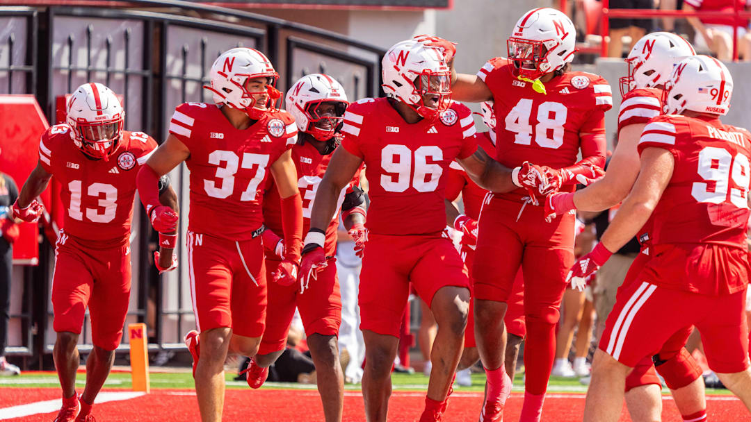 Sep 13, 2025; Lincoln, Nebraska, USA; Nebraska Cornhuskers defensive lineman Williams Nwaneri (96) and defensive back Caden VerMaas (48) celebrate after a fumble return for a touchdown against the Houston Christian Huskies during the second quarter at Memorial Stadium. Mandatory Credit: Dylan Widger-Imagn Images
