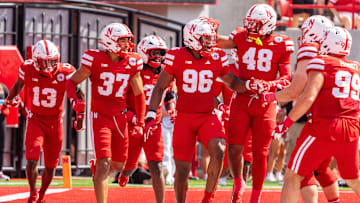 Sep 13, 2025; Lincoln, Nebraska, USA; Nebraska Cornhuskers defensive lineman Williams Nwaneri (96) and defensive back Caden VerMaas (48) celebrate after a fumble return for a touchdown against the Houston Christian Huskies during the second quarter at Memorial Stadium. Mandatory Credit: Dylan Widger-Imagn Images