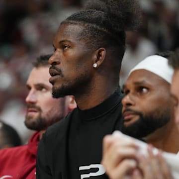 Apr 27, 2024; Miami, Florida, USA; Miami Heat forward Jimmy Butler (22) looks on from the bench against the Boston Celtics in the first half during game three of the first round for the 2024 NBA playoffs at Kaseya Center. Mandatory Credit: Jim Rassol-Imagn Images