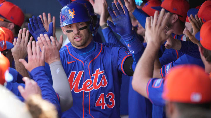 Feb 26, 2024; West Palm Beach, Florida, USA;  New York Mets left fielder Trayce Thompson (43) is congratulated by teammates after hitting a grand slam against the Washington Nationals in the third inning at CACTI Park of the Palm Beaches.