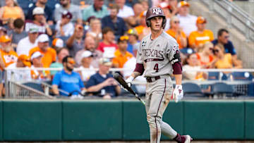 Jun 24, 2024; Omaha, NE, USA; Texas A&M Aggies center fielder Travis Chestnut (4) walks off after striking out against the Tennessee Volunteers during the fifth inning at Charles Schwab Field Omaha. Mandatory Credit: Dylan Widger-Imagn Images