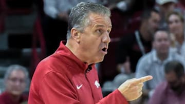 Arkansas Razorbacks coach John Calipari directing the exhibition opener against the Kansas Jayhawks at Bud Walton Arena in Fayetteville, Ark.
