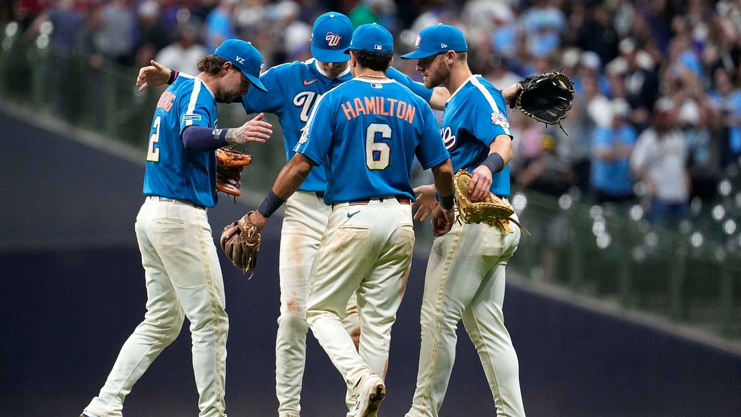 Jun 26, 2026; Milwaukee, Wisconsin, USA; Milwaukee Brewers second baseman Brice Turang (2), shortstop Cooper Pratt (12),  first baseman Jake Bauers (9), and   third baseman David Hamilton (6) celebrate a 6-2 win over the Chicago Cubs at American Family Field. Mandatory Credit: Michael McLoone-Imagn Images