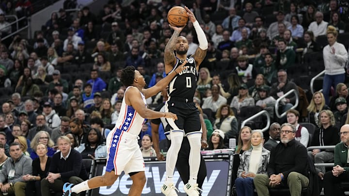 Bucks guard Damian Lillard (0) shoots during the first quarter against the Philadelphia 76ers at Fiserv Forum.