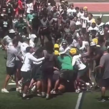 Upland and Damien High football teams get into a scuffle after 7on7 tournament at Mission Viejo High.