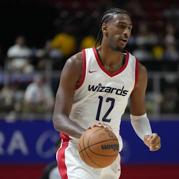 Jul 12, 2024; Las Vegas, NV, USA;  Washington Wizards center Alex Sarr (12) dribbles the ball against the Atlanta Hawks during the second half at Thomas & Mack Center. Mandatory Credit: Lucas Peltier-USA TODAY Sports