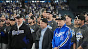 Oct 17, 2025; Los Angeles, California, USA; Los Angeles Dodgers owner Mark Walter, president of baseball operations Andrew Friedman and president Stan Kasten react after game four of the NLCS round for the 2025 MLB playoffs against the Milwaukee Brewers at Dodger Stadium. Mandatory Credit: Kirby Lee-Imagn Images
