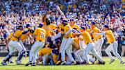 Jun 22, 2025; Omaha, Neb, USA; The LSU Tigers celebrate after defeating the Coastal Carolina Chanticleers to win the championship at Charles Schwab Field. Mandatory Credit: Dylan Widger-Imagn Images