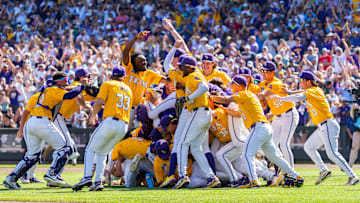 Jun 22, 2025; Omaha, Neb, USA; The LSU Tigers celebrate after defeating the Coastal Carolina Chanticleers to win the championship at Charles Schwab Field. Mandatory Credit: Dylan Widger-Imagn Images