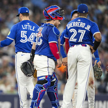 Jul 2, 2025; Toronto, Ontario, CAN; Toronto Blue Jays manager John Schneider (14) relieves Toronto Blue Jays pitcher Brendon Little (54) during the sixth inning against the New York Yankees at Rogers Centre. 